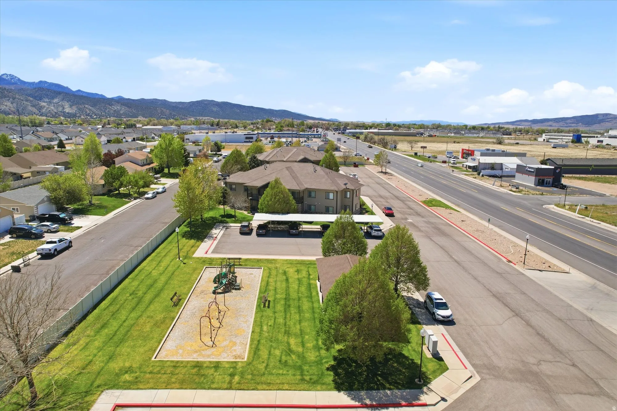 Aerial view of residential area featuring mountains