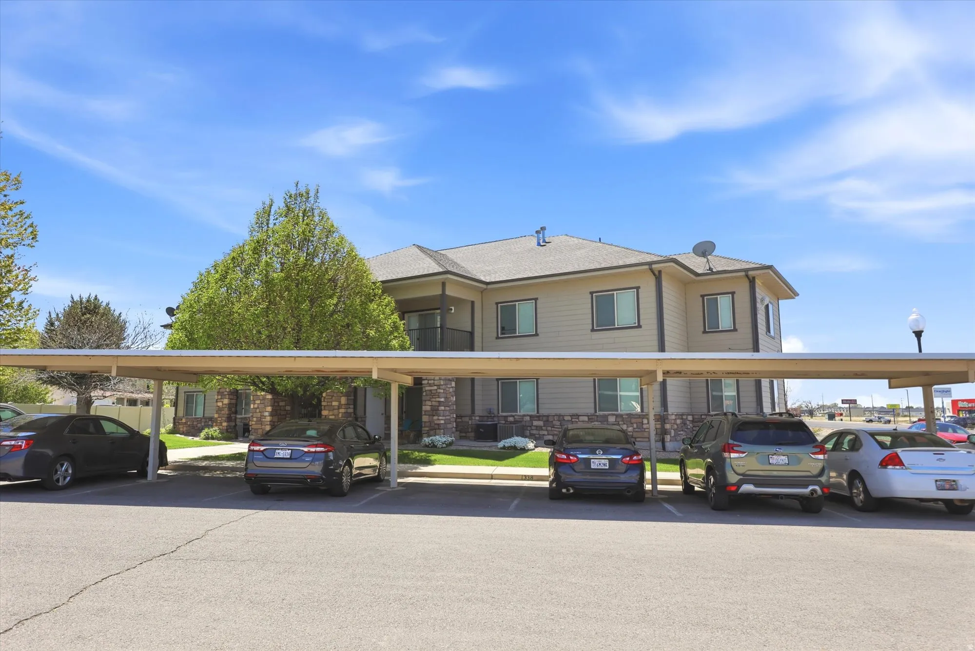View of front of house featuring covered parking