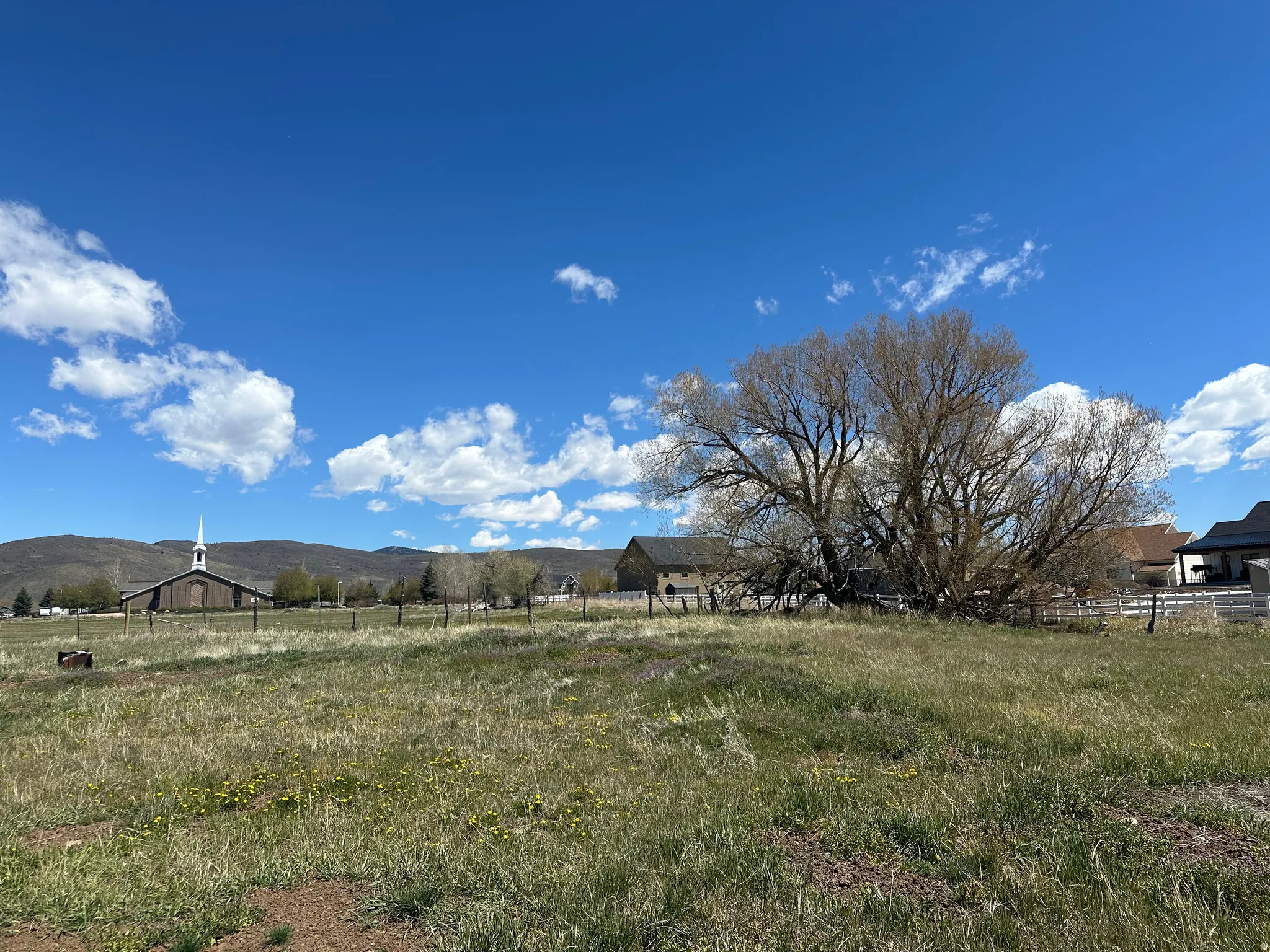 View of yard featuring a view of rural / pastoral area and a mountain view
