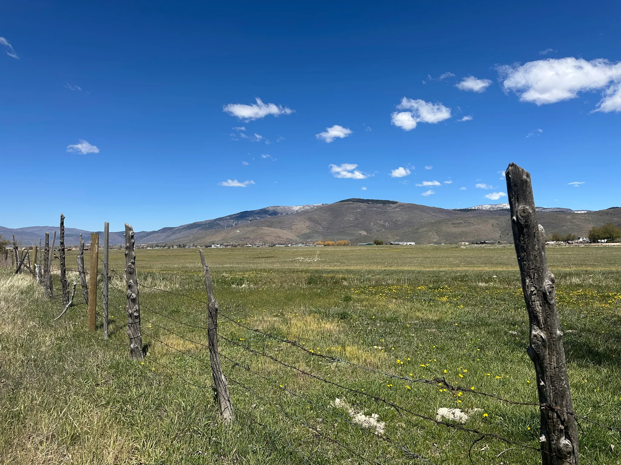 View of mountain background featuring rural landscape
