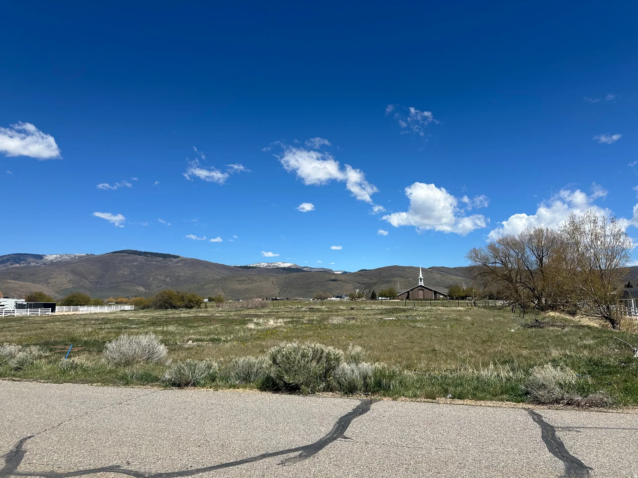 View of mountain background featuring rural landscape
