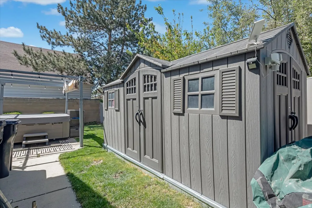 View of shed featuring a hot tub