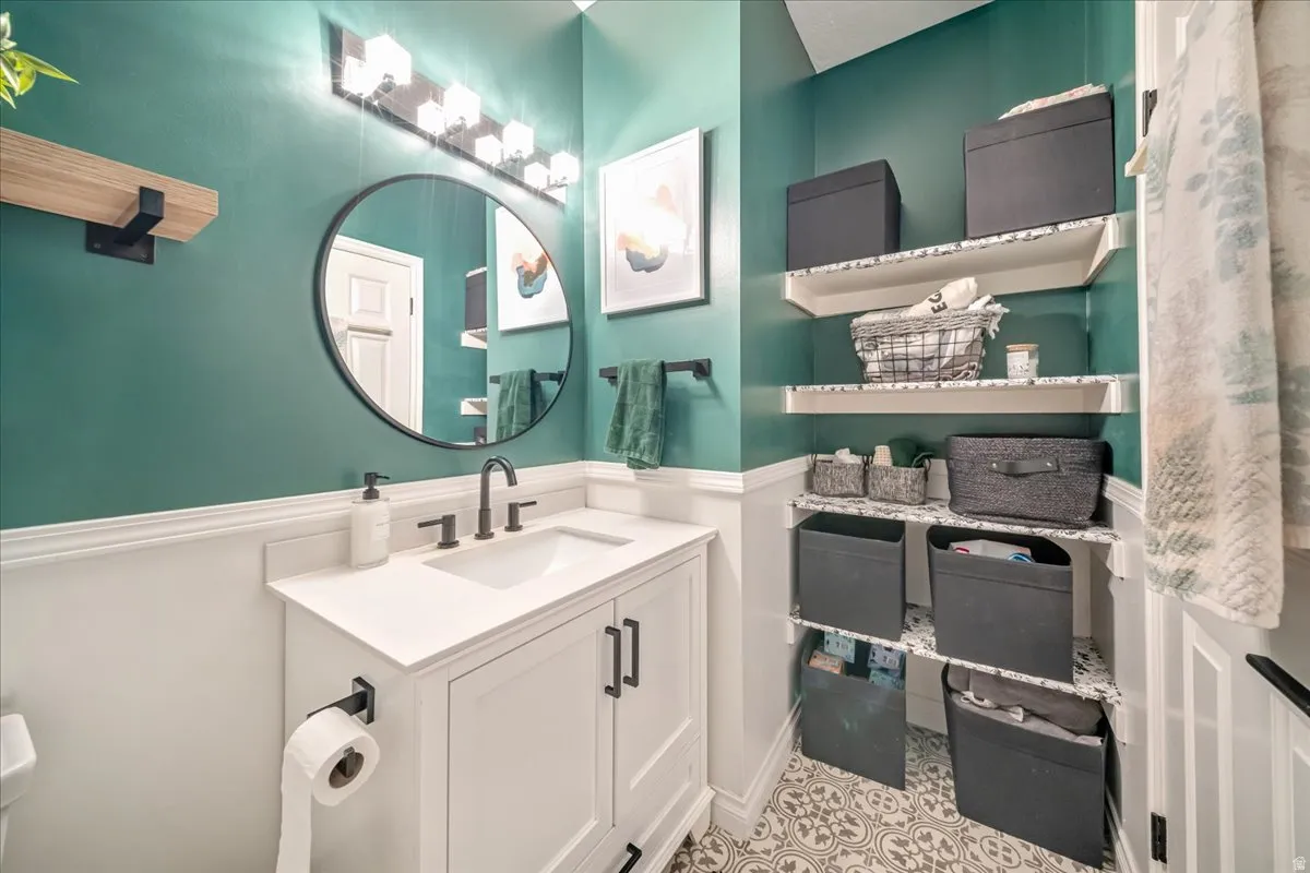 Bathroom featuring vanity and toilet