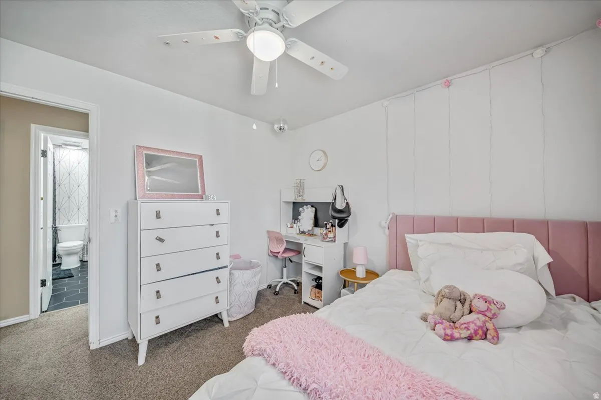 Bedroom featuring carpet and a ceiling fan