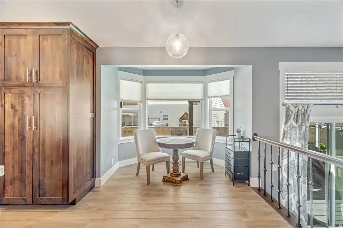 Dining space with light wood-type flooring and baseboards