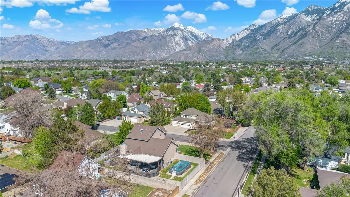 Aerial perspective of suburban area featuring a mountain backdrop