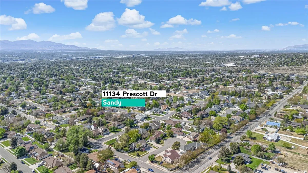 Aerial perspective of suburban area featuring a mountainous background