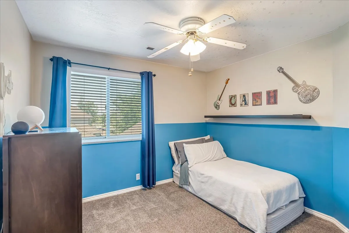Bedroom featuring carpet flooring and ceiling fan