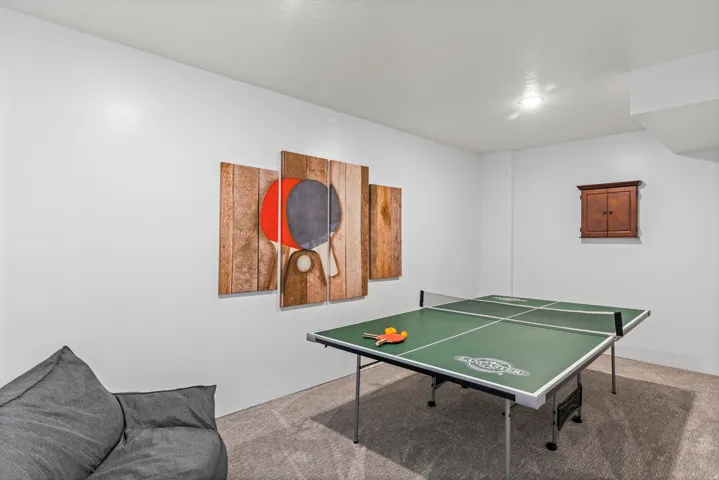 Game room with carpet flooring