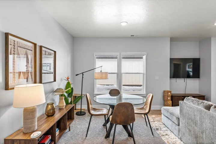 Carpeted dining area with baseboards