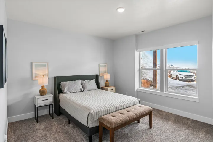 Carpeted bedroom with baseboards