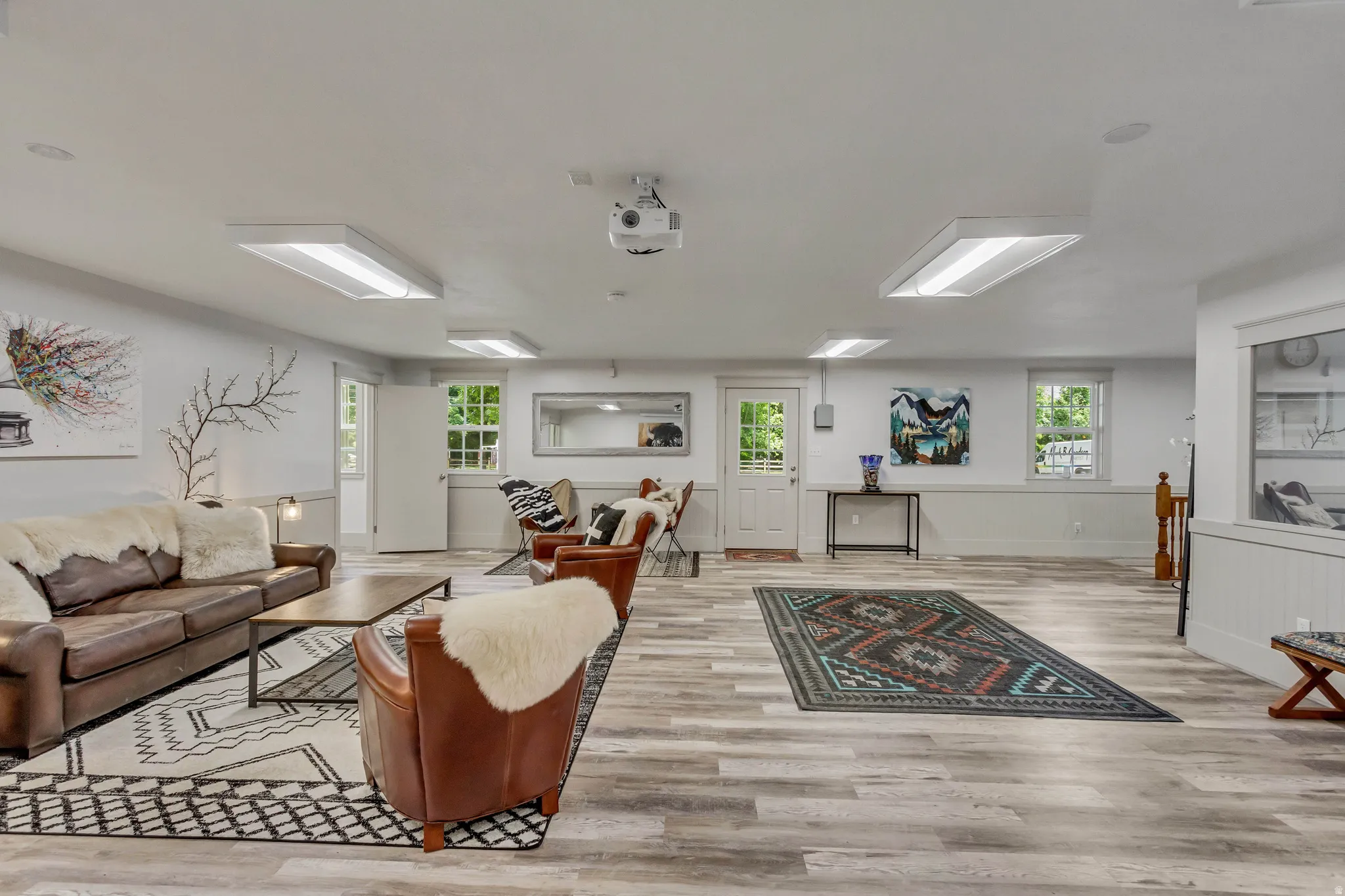 Living area featuring light wood-type flooring and baseboards
