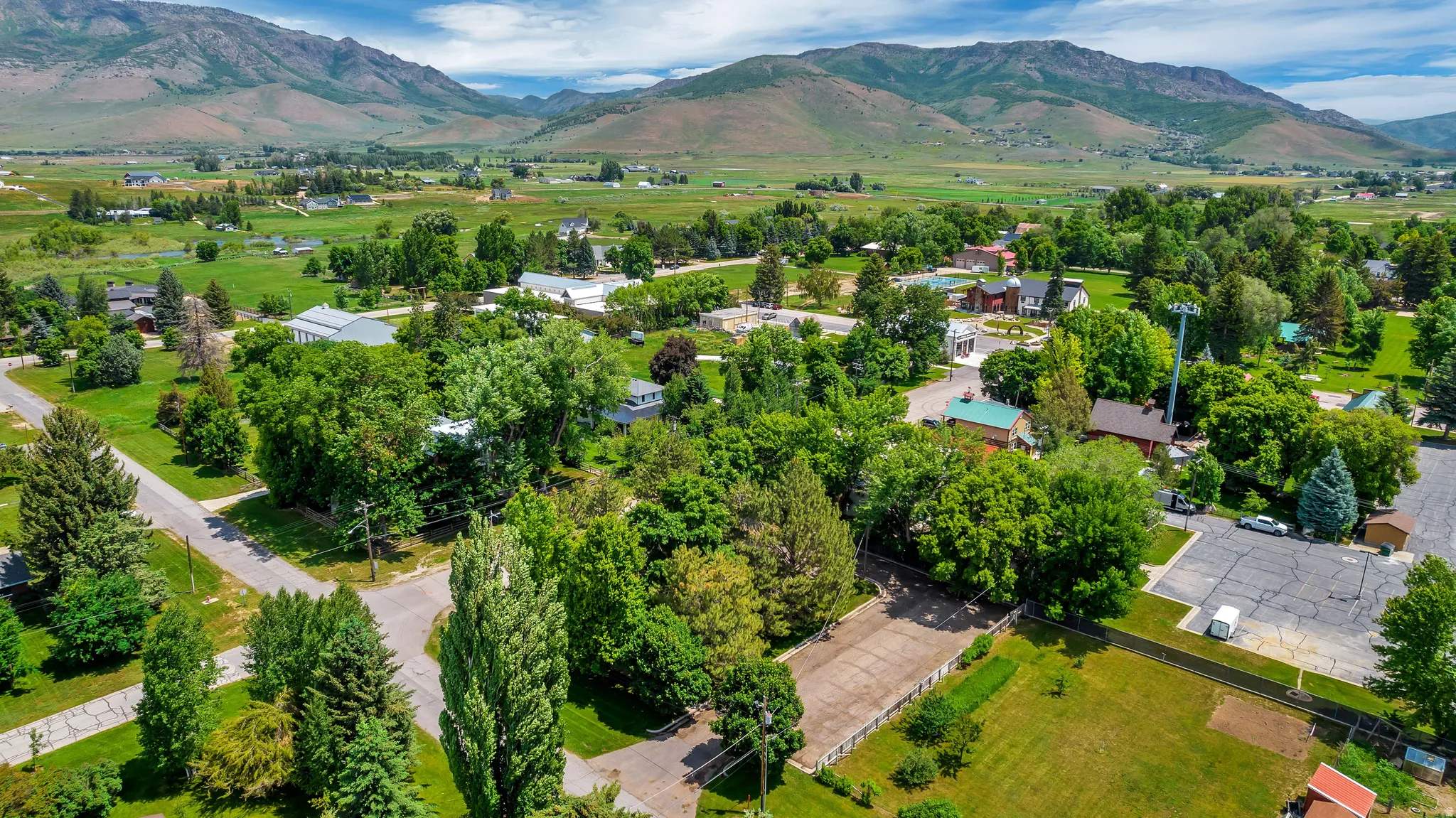 Aerial perspective of suburban area featuring a mountain backdrop