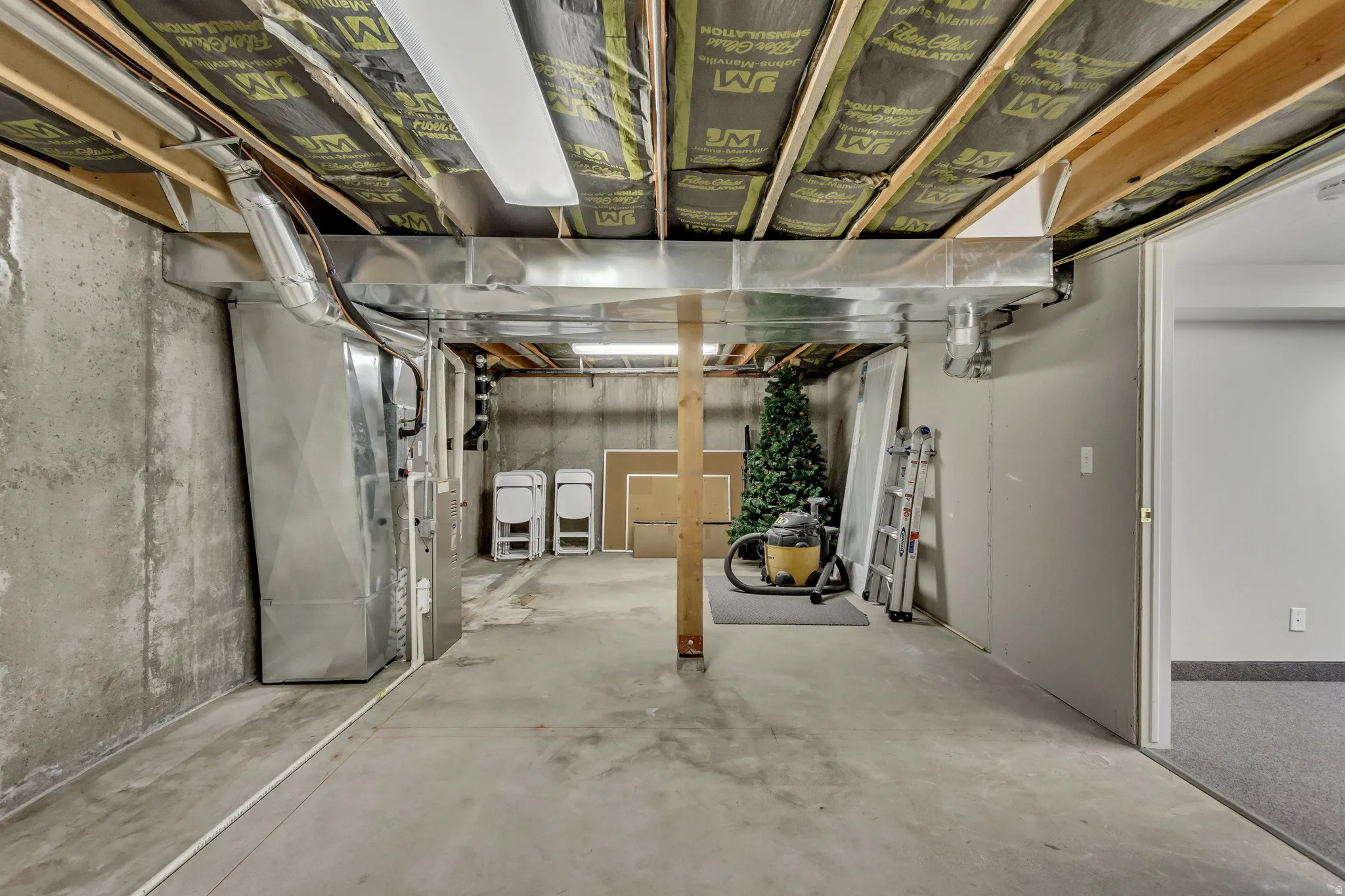 Unfinished below grade area with heating unit
