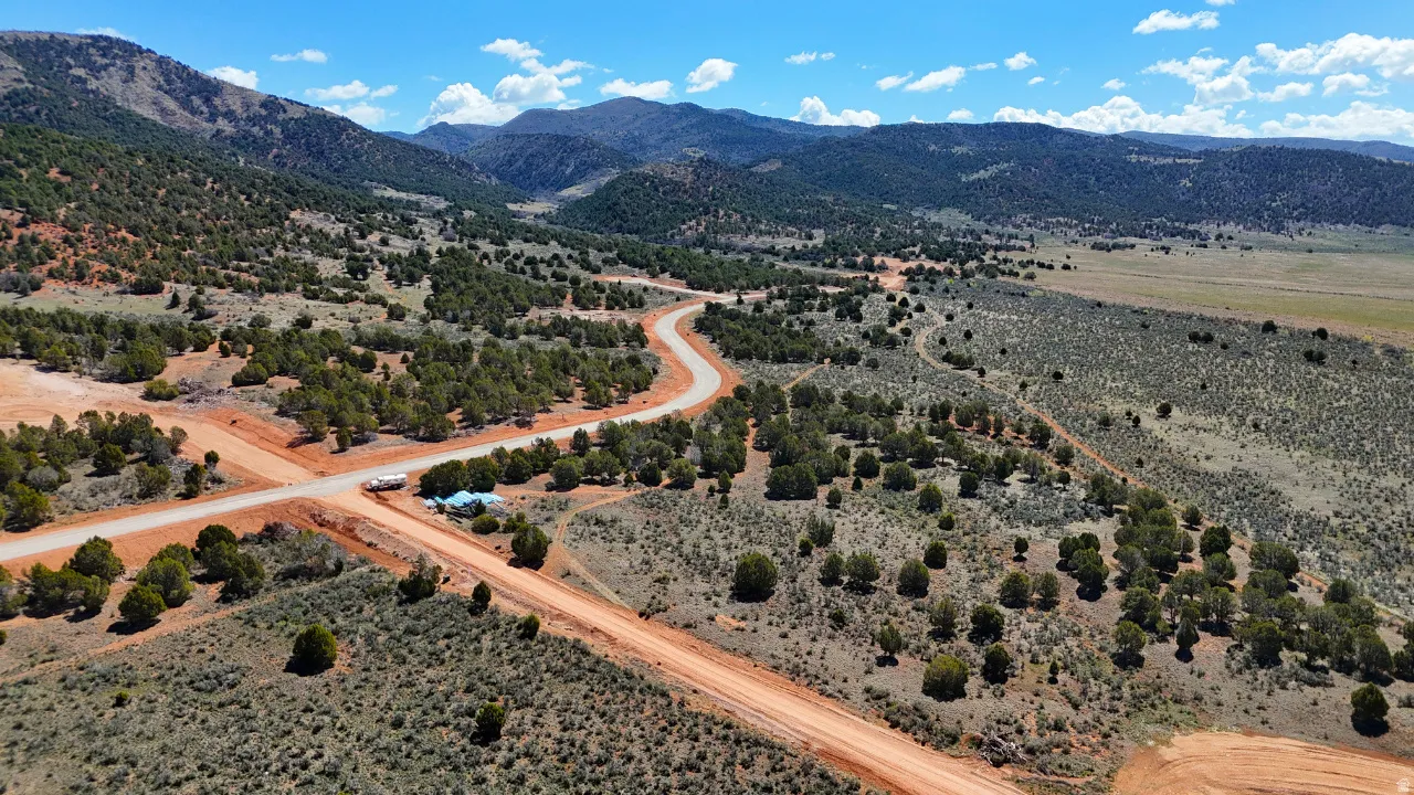 View of rural area featuring a mountainous background and a desert landscape