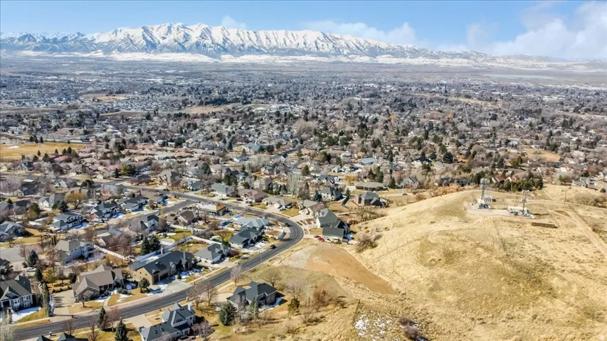 Aerial perspective of suburban area with a mountainous background