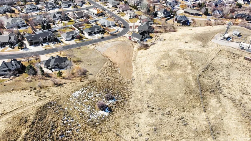 Aerial view of property's location with nearby suburban area
