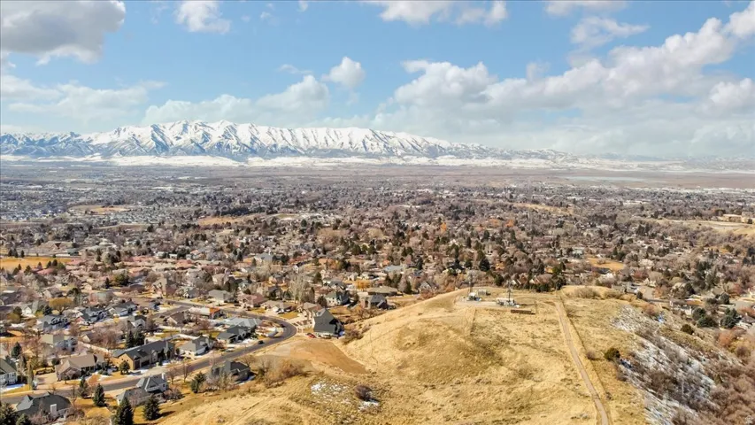 Aerial perspective of suburban area with a mountainous background