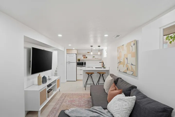 Private Lower Level Apartment Living area featuring recessed lighting and light tile flooring