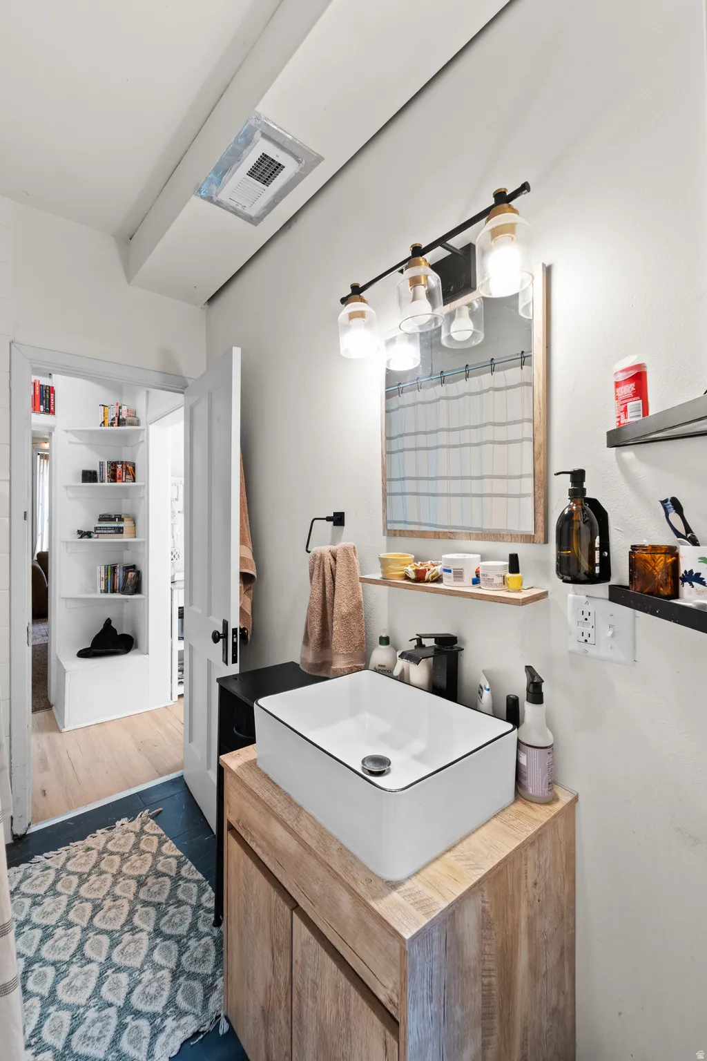 Bathroom with vanity and a shower with shower curtain