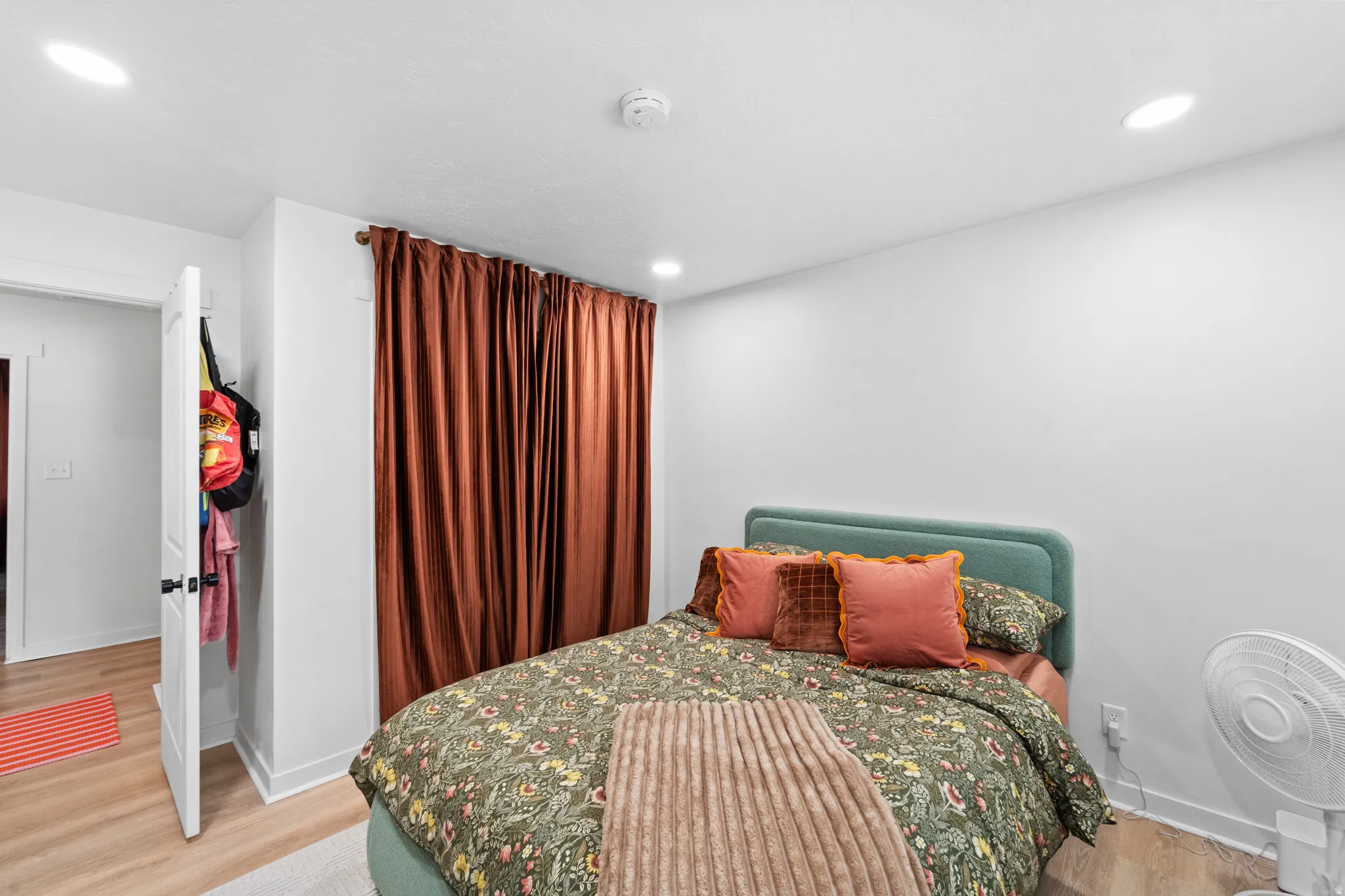 Bedroom featuring light wood-style floors and recessed lighting