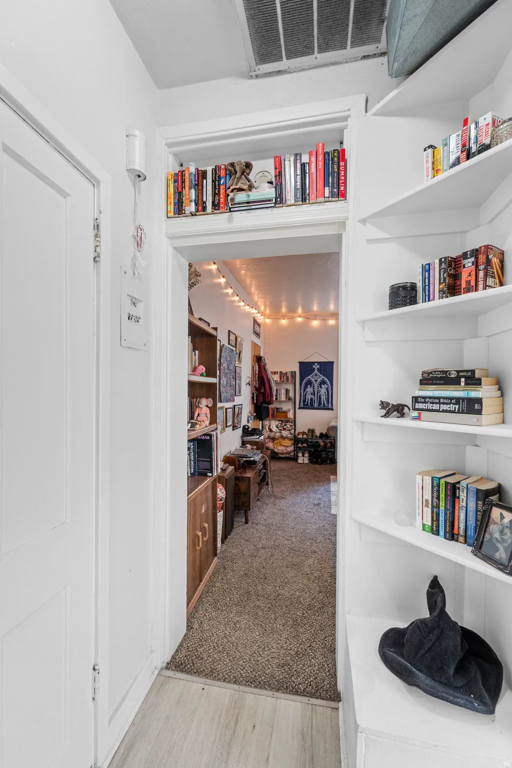Hall featuring light wood finished floors