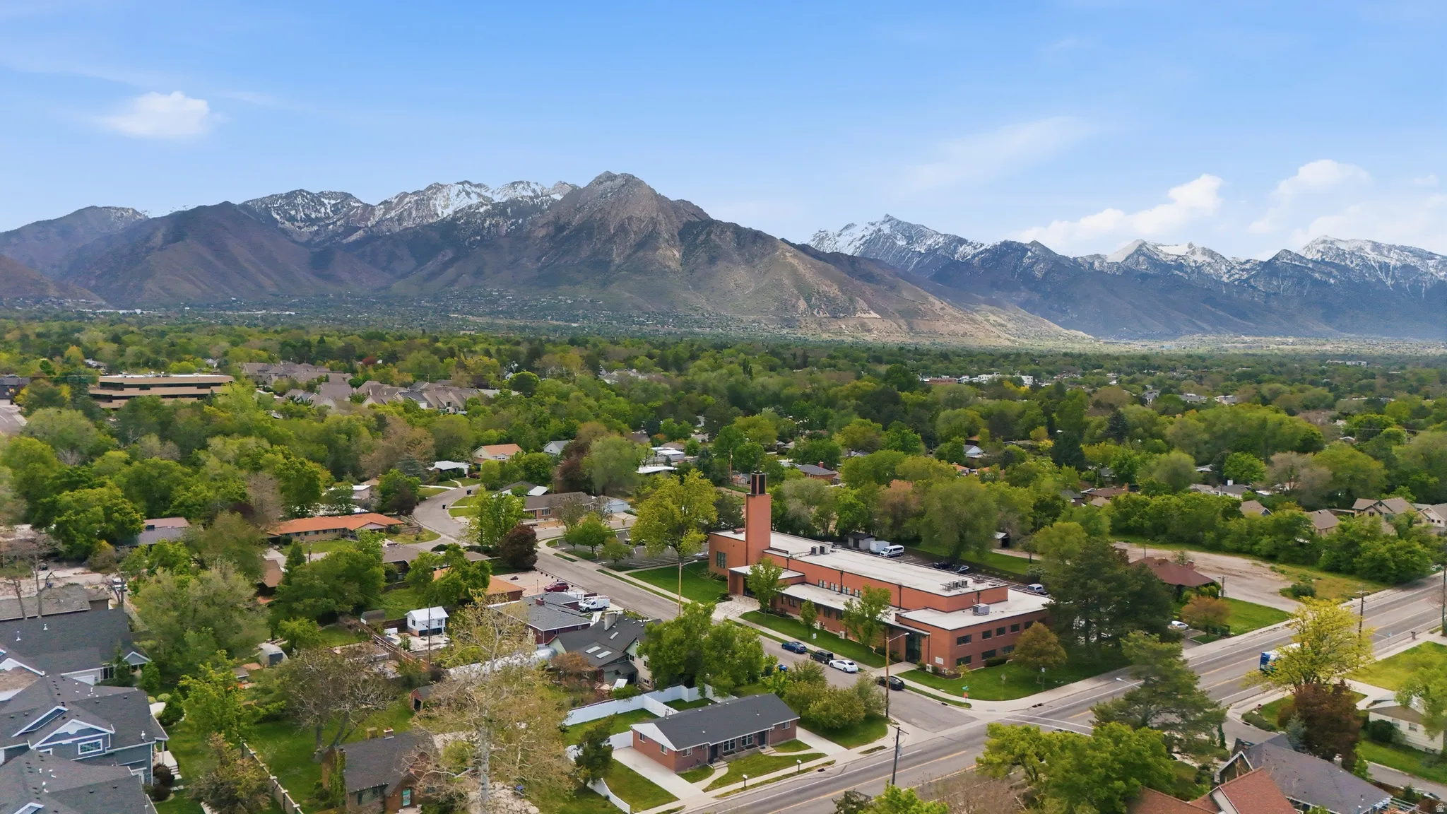 Aerial perspective of suburban area featuring mountains