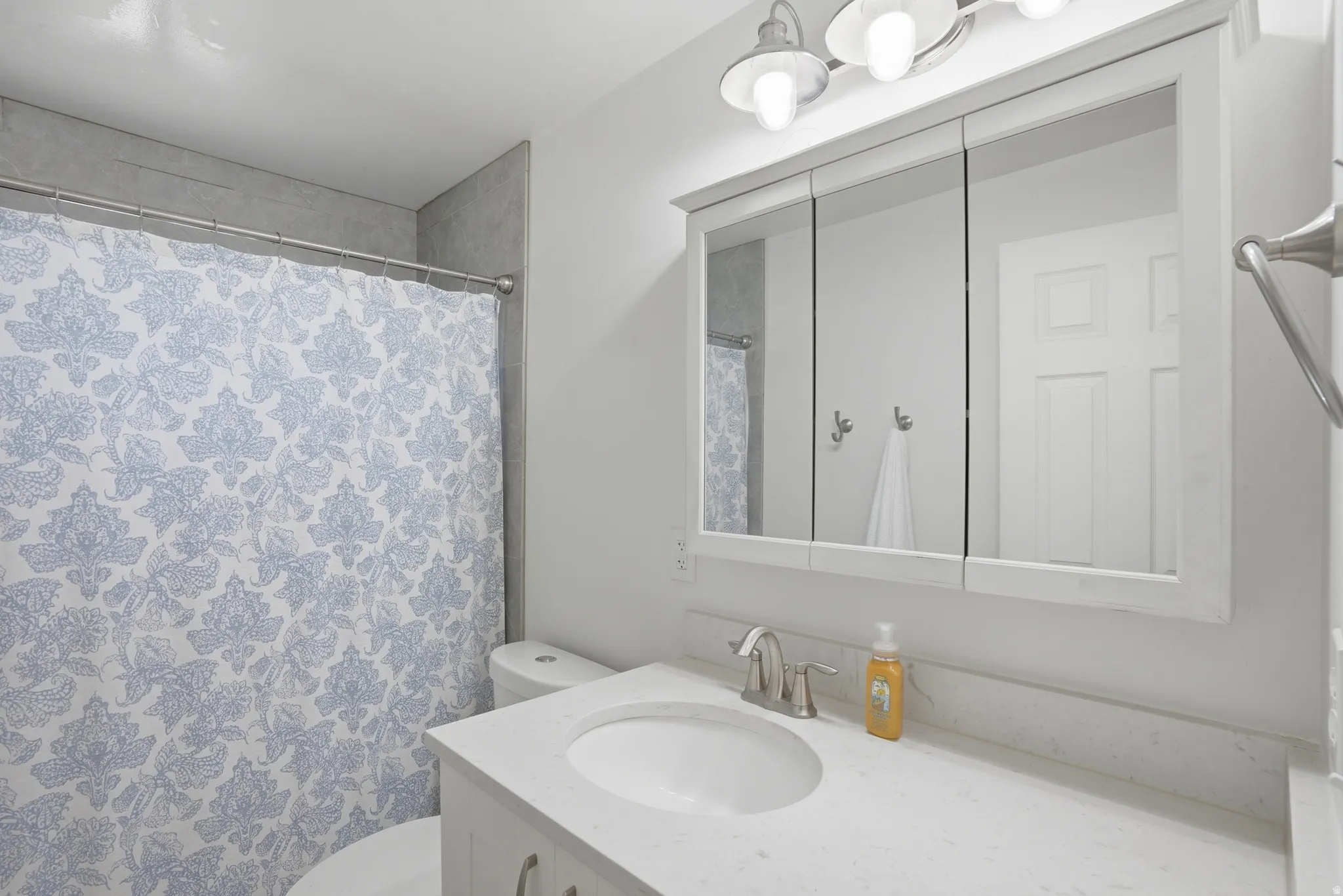 Bathroom with vanity and a shower with curtain