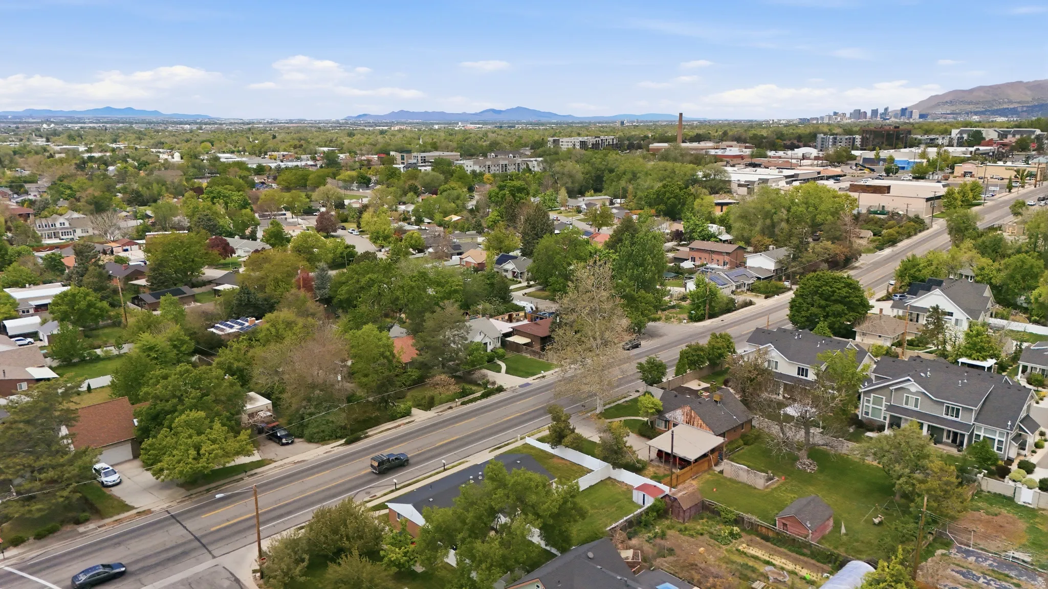 Aerial view of residential area featuring a mountainous background