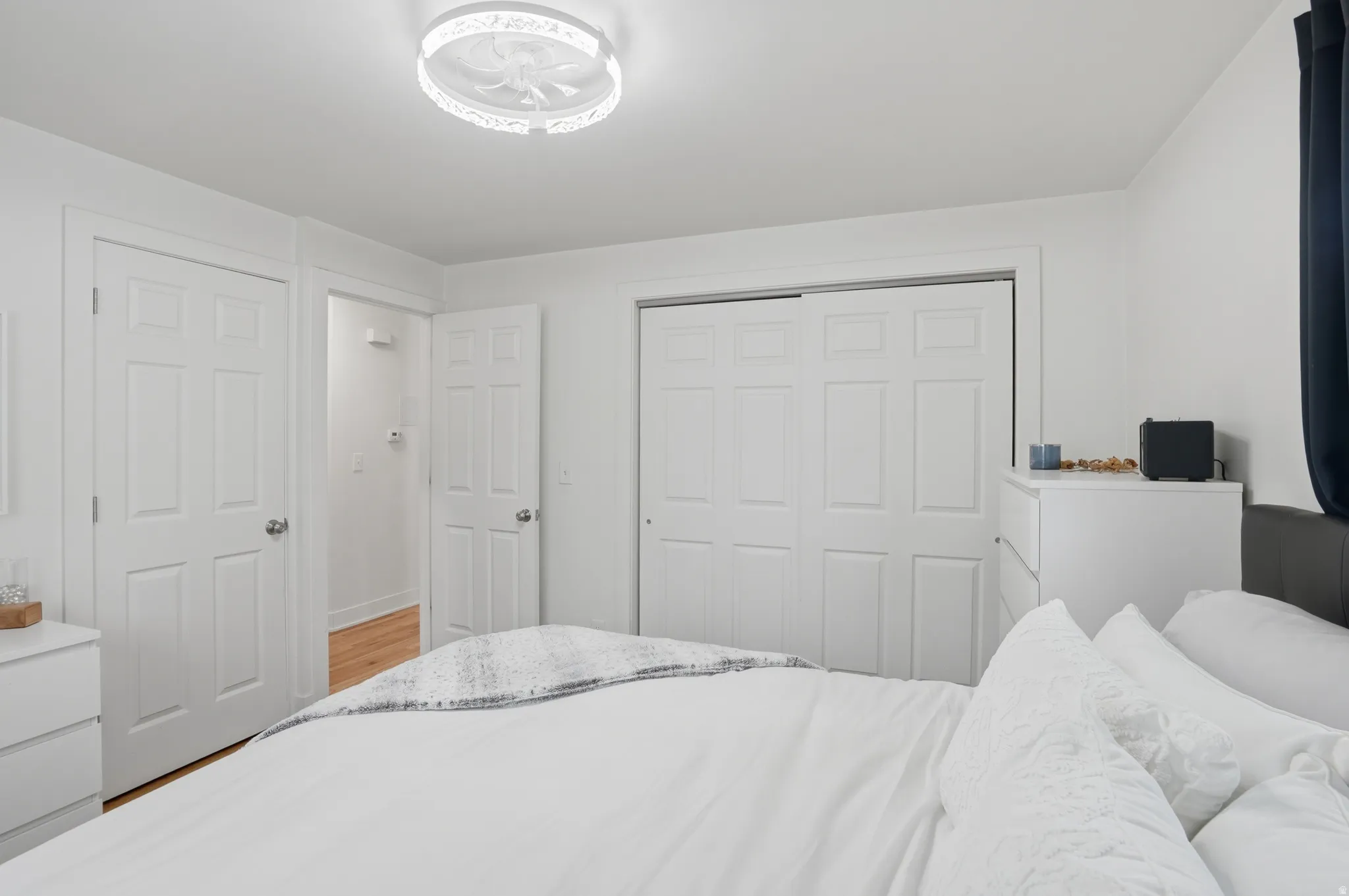 Bedroom with a closet and light wood-style flooring