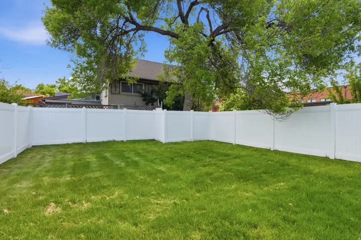 View of fenced backyard