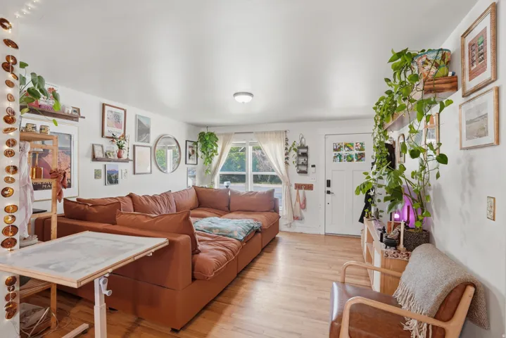 Living room featuring light wood-style flooring