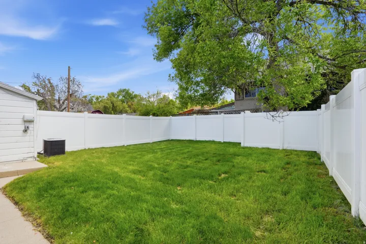 View of fenced backyard