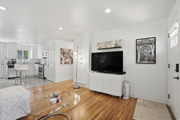 Living room featuring light wood-style floors and recessed lighting