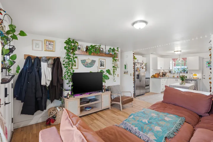 Living room with light wood-style flooring