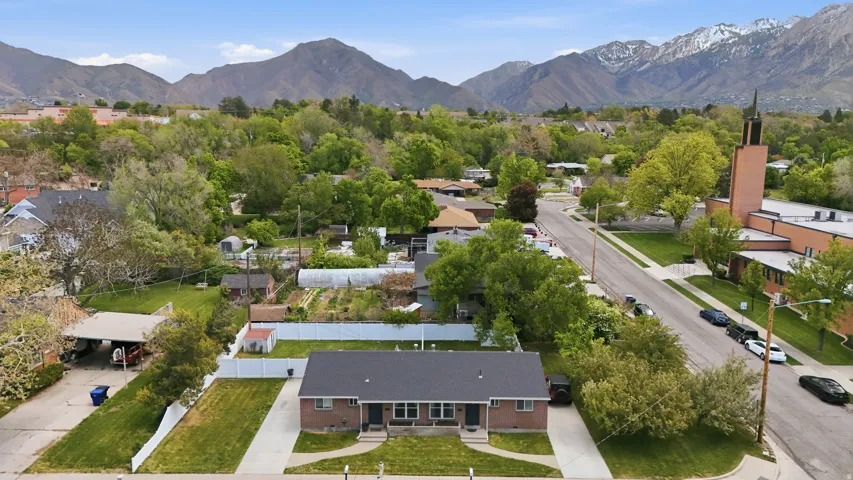 Aerial perspective of suburban area featuring a mountainous background