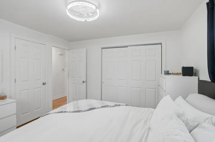 Bedroom with a closet and light wood-style flooring