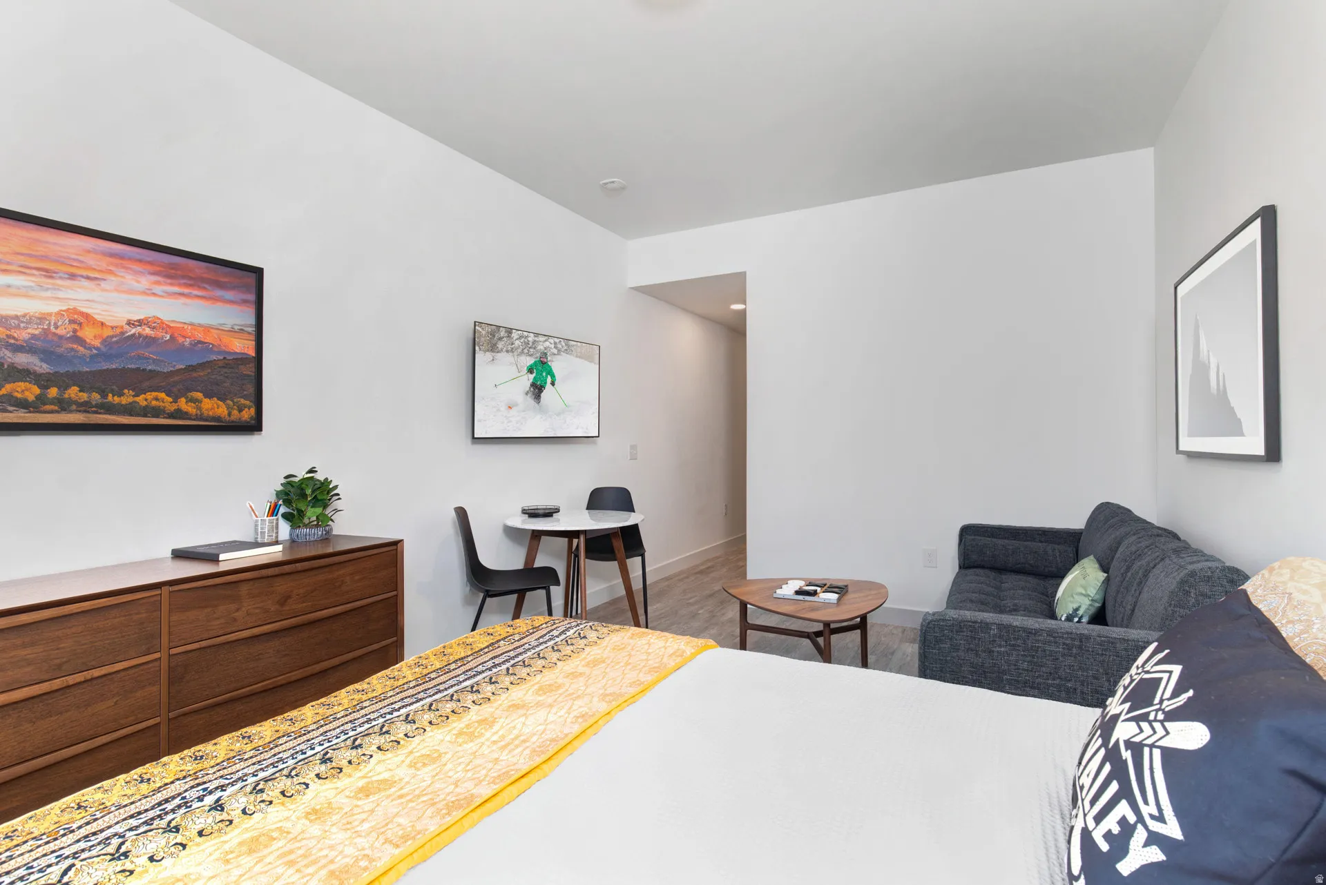 Bedroom with wood finished floors and baseboards