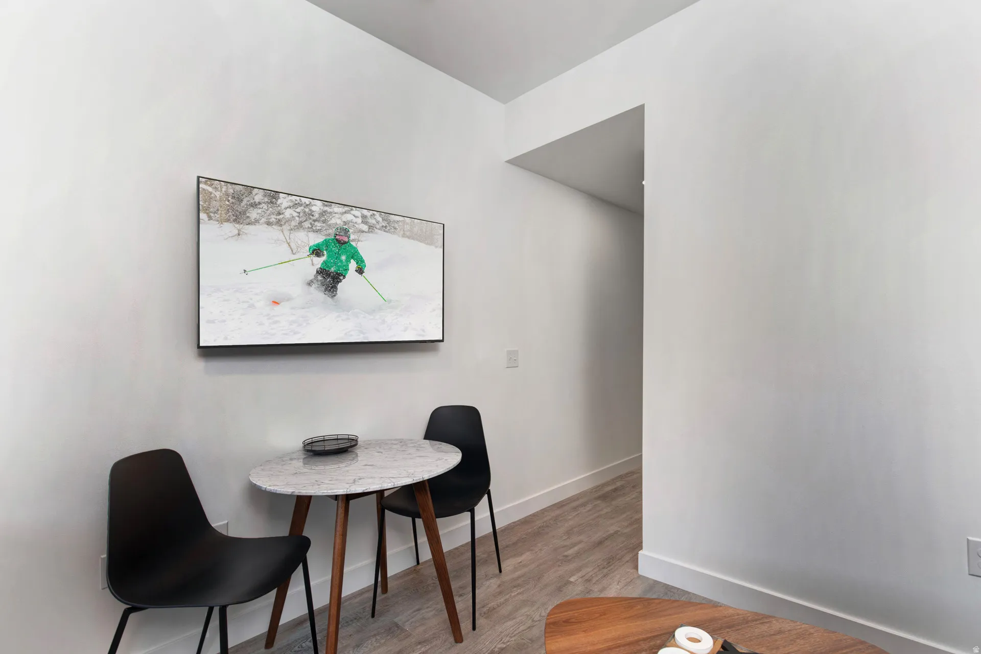 Dining space featuring light wood finished floors and baseboards