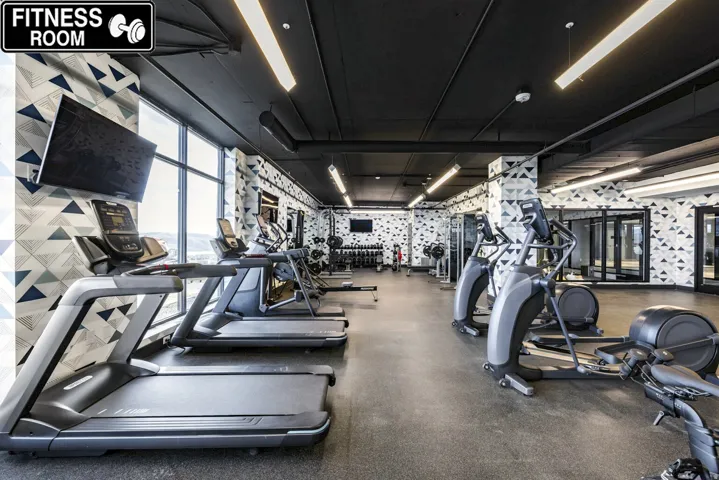 Workout area featuring wallpapered walls