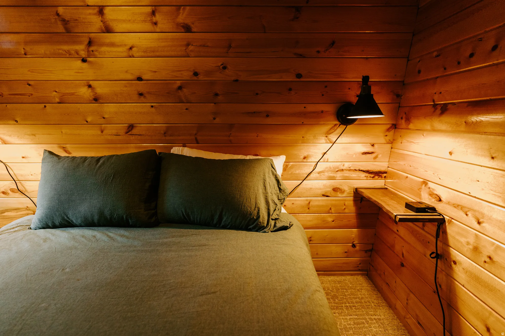 Bedroom with wooden walls