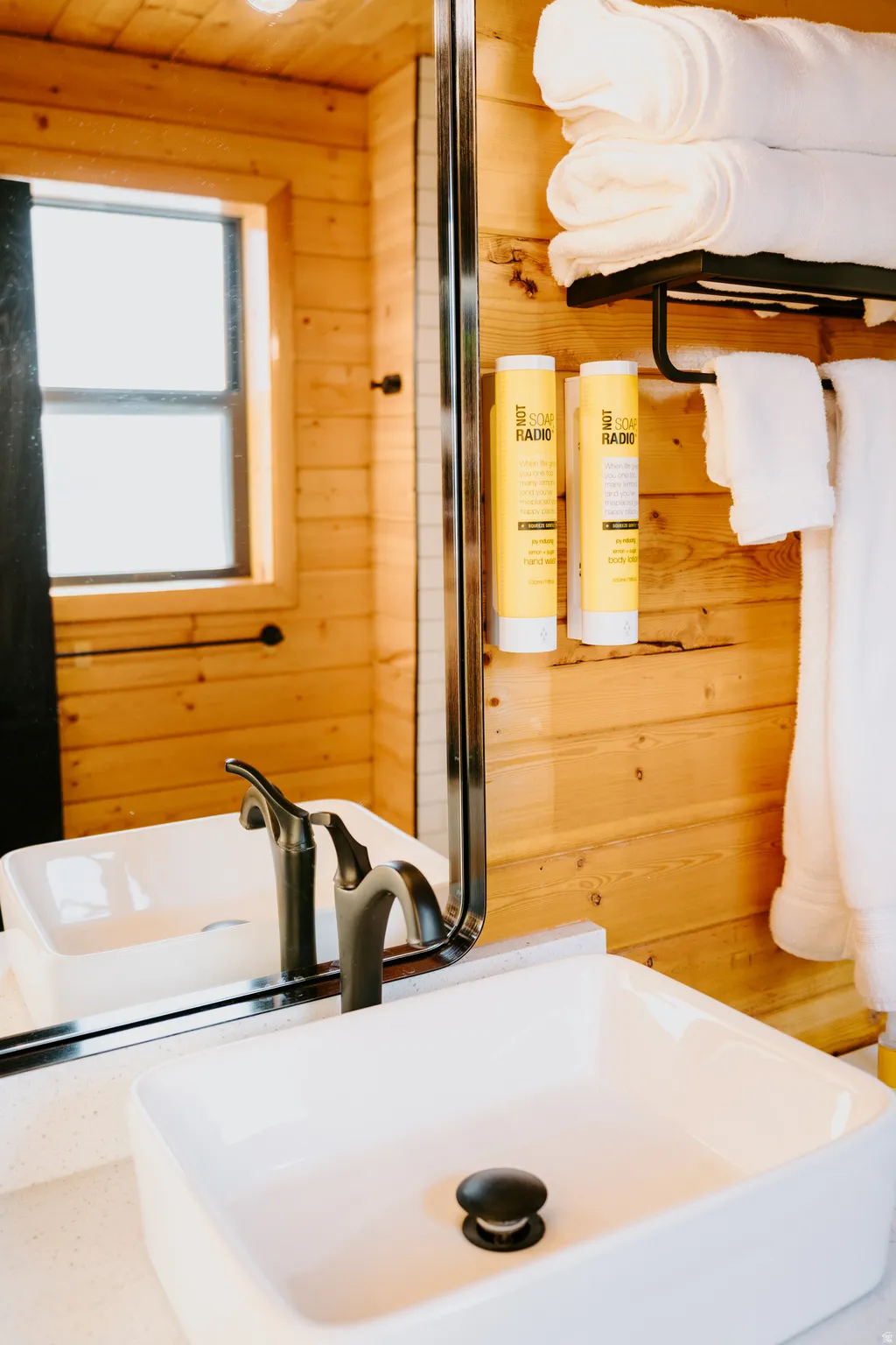 Bathroom with wooden walls and wood ceiling