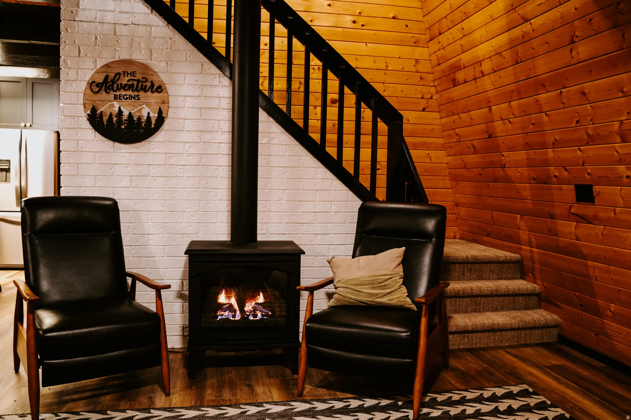 Sitting room with stairway and wood finished floors