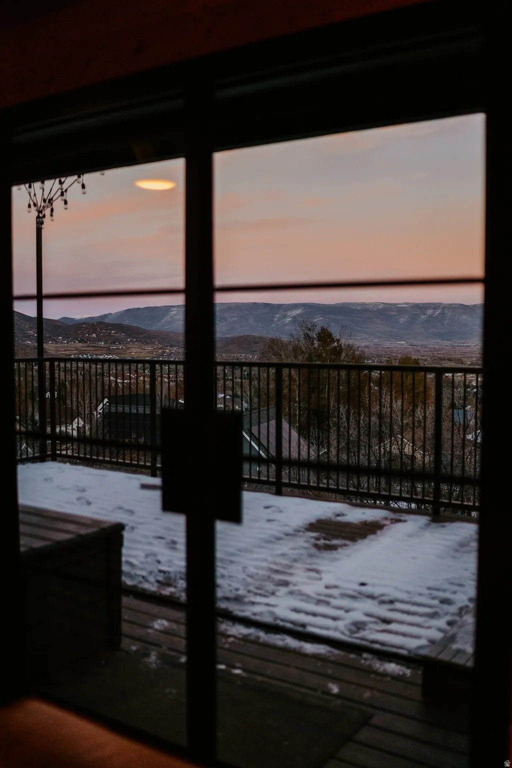 Doorway featuring a mountain view and healthy amount of natural light