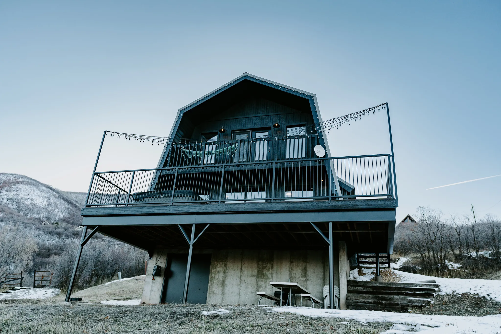 View of front of home with a deck with mountain view