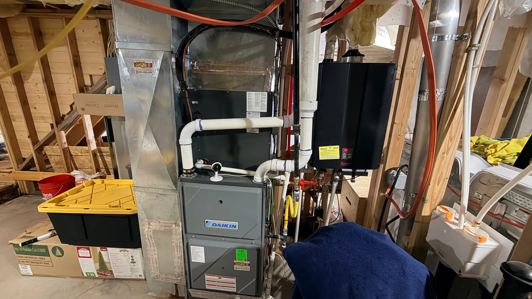 Utility room featuring heating unit