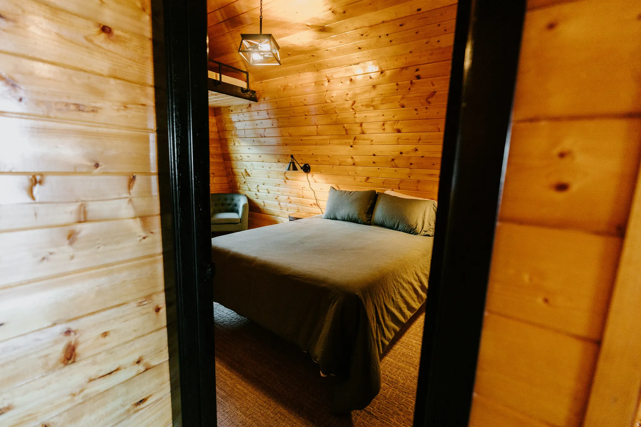 Bedroom with wood walls