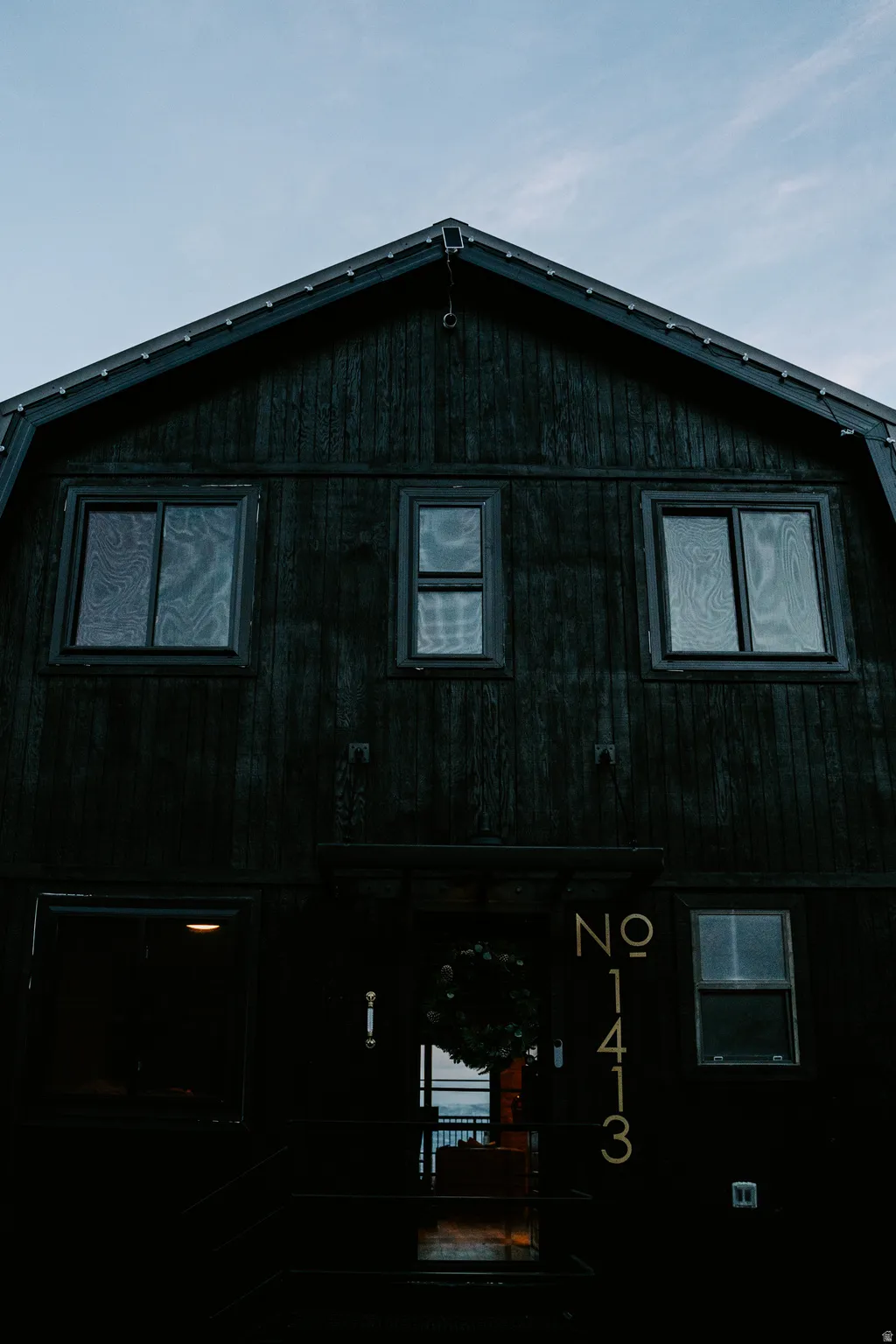 View of side of property featuring a porch