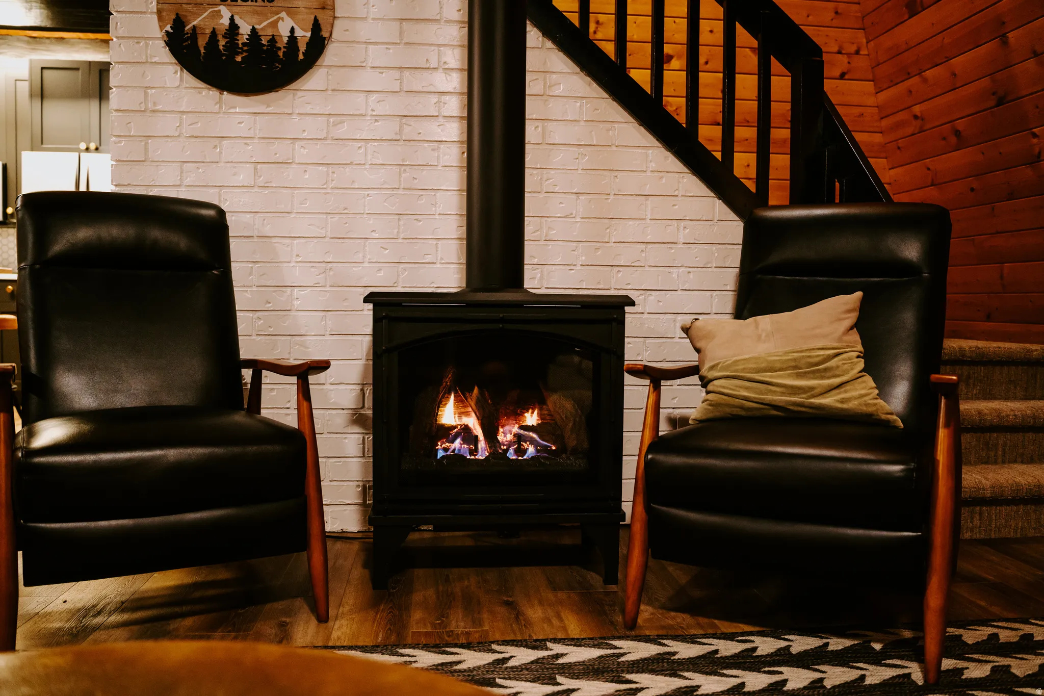 Living area featuring stairway and dark wood-style floors
