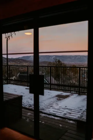 Doorway featuring a mountain view and healthy amount of natural light